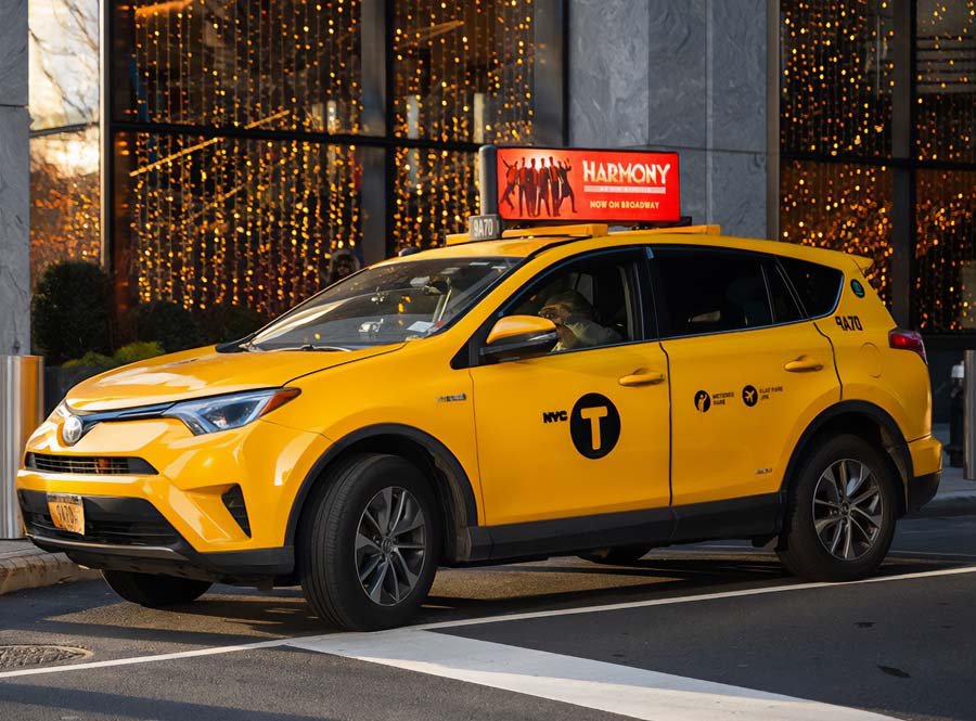 Adder digital top on yellow taxi